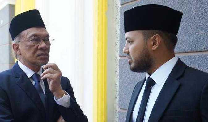 Prime Minister Anwar Ibrahim and his former political secretary Farhash Wafa Salvador. Photo: Facebook 
