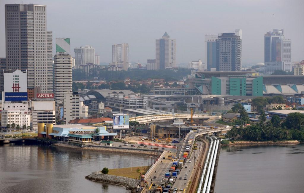 The border crossing between Singapore and Johor, where stringent checks are carried out before vehicles are allowed to enter the city-state. Photo: AFP