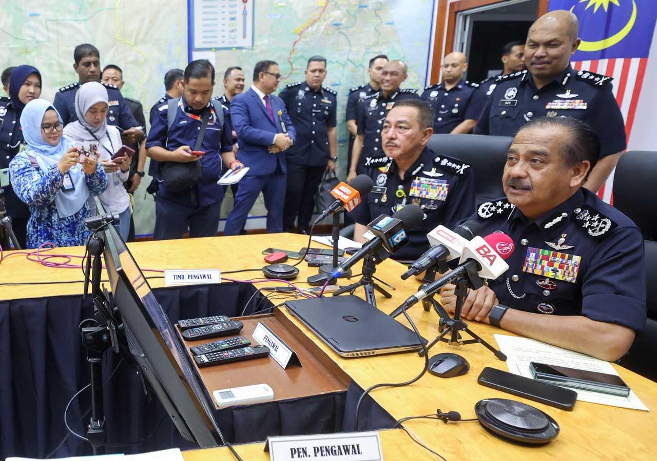 Inspector-General of Police Razarudin Husain (right) speaks in a press conference at the Kelantan contingent police headquarters in Kota Bharu, July 16. Photo: Bernama