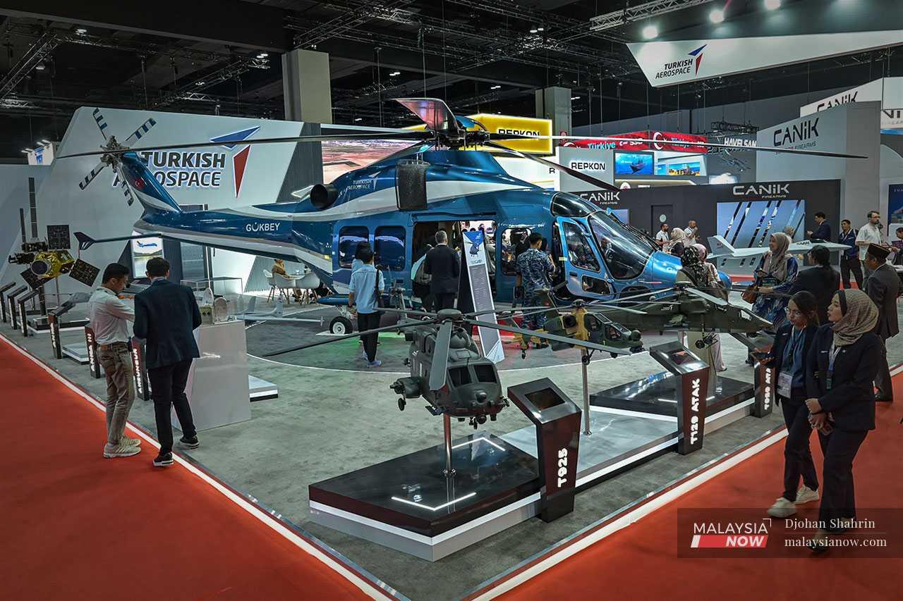 People visit the Turkish aerospace exhibition hall for a glimpse of air force assets and satellites.