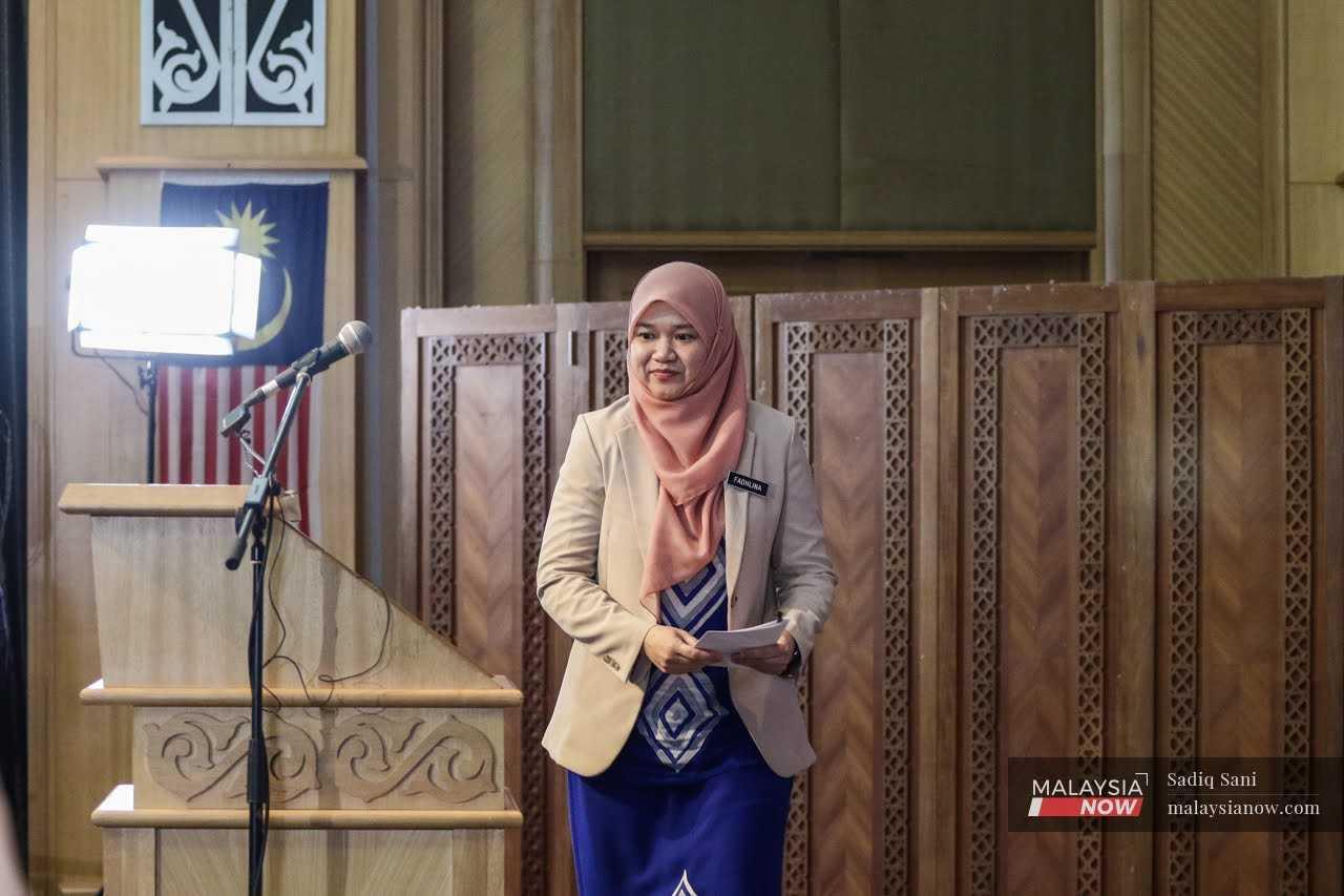 Education Minister Fadhlina Sidek is seen without Cabinet allies as she faces pressure from DAP to relax rules prohibiting alcohol companies from donating to schools.