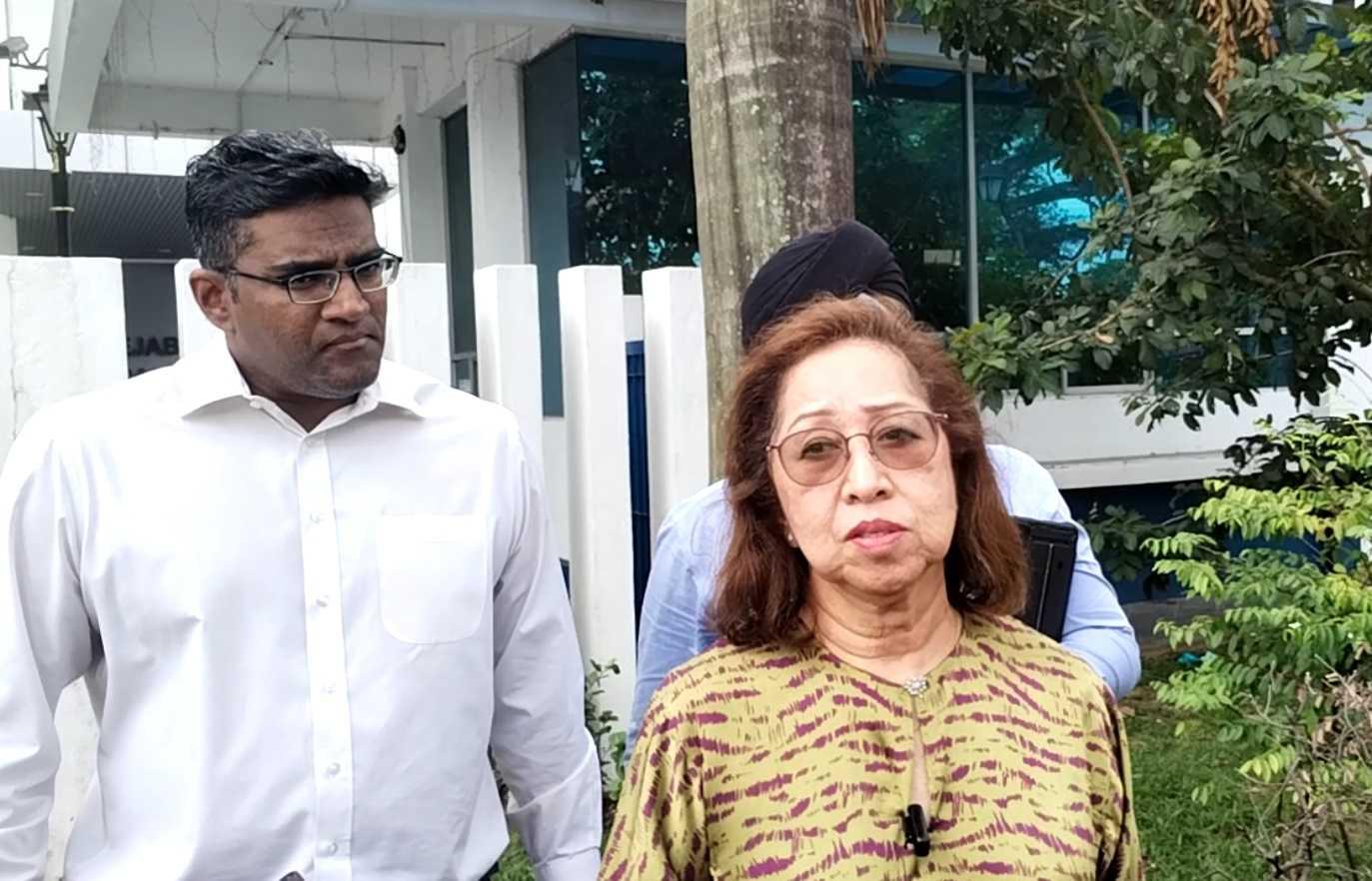 Naimah Khalid with lawyer Rajesh Nagarajan outside the Sentul police headquarters today.