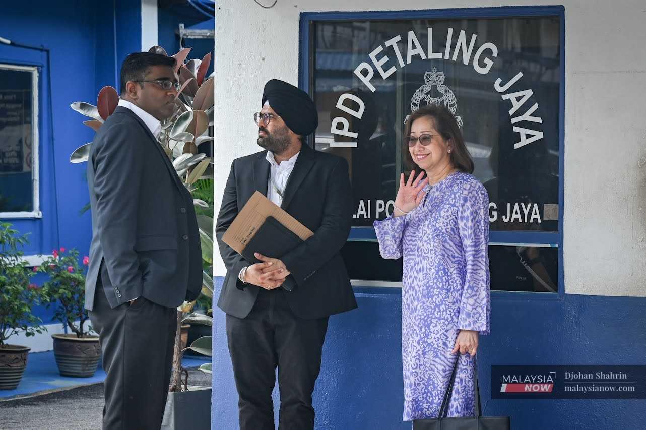 Lawyers Rajesh Nagarajan and Sachpreetraj Singh with Naimah Khalid after filing a police report in Petaling Jaya on Sept 30, 2024.