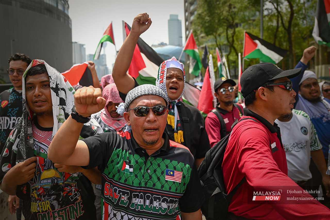 Shouts of 'Allahu Akbar' (God is the greatest) fill the air as people make their way to the US embassy.