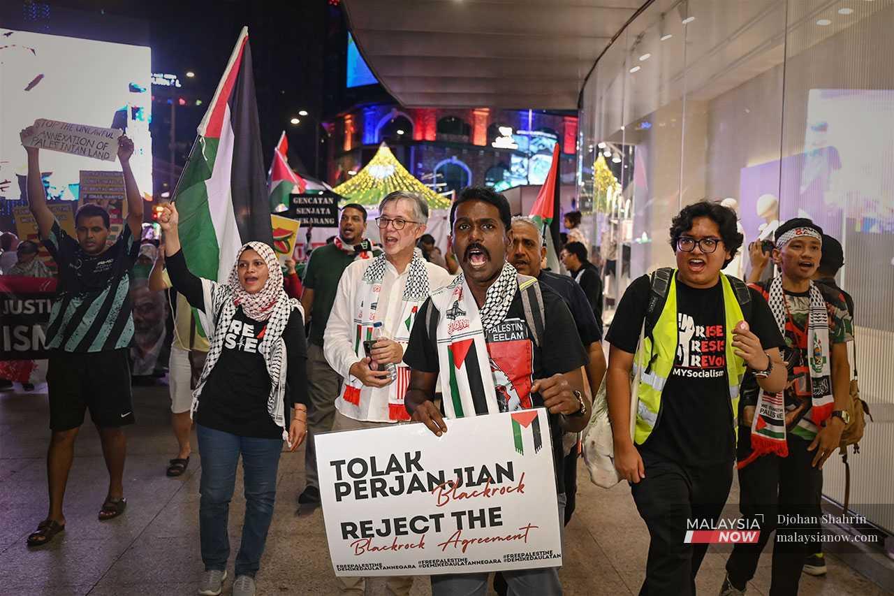 Mythreyar with activists during the Gaza solidarity rally in August.